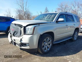 2016 GMC Yukon Denali with VIN 1GKS2CKJ5GR393269, listed as a IAAI auction lot 41963630 with 158,584 mi miles and . Bid and sale history available at DreamBid. Image 2.