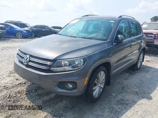 2014 Volkswagen Tiguan SE z VIN WVGAV3AX0EW576108, wystawiony jako IAAI lot #42405804 z przebiegiem 117 530 mil mil oraz . Historia ofert i sprzedaży dostępna na DreamBid. Obrazek 2.