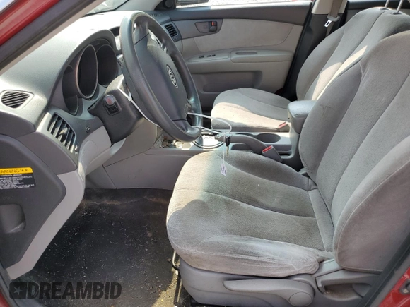 2009 Kia Optima LX z VIN KNAGE228795334599, wystawiony jako Copart lot #59276515 z przebiegiem 180 399 mil mil oraz Szkoda całkowita • Salvage title. Historia ofert i sprzedaży dostępna na DreamBid. Obrazek 7.