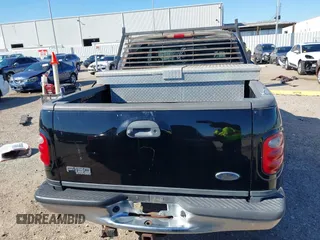 2003 Ford F-150 XLT with VIN 1FTRW07L43KB05221, listed as a IAAI auction lot 41762332 with 226,660 mi miles. Bid and sale history available at carsss.com. Image 16.