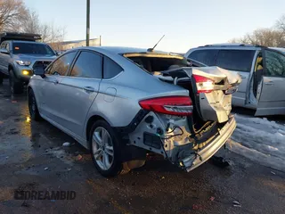 2018 Ford Fusion SE z VIN 3FA6P0LU4JR269064, wystawiony jako IAAI lot #41222967 z przebiegiem 115 077 mil mil oraz . Historia ofert i sprzedaży dostępna na DreamBid. Obrazek 3.