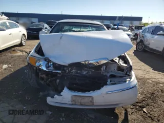1999 Lincoln Town Car Signature z VIN 1LNHM82W9XY692757, wystawiony jako Copart lot #58091935 z przebiegiem 165 635 mil mil oraz Szkoda całkowita • Salvage title. Historia ofert i sprzedaży dostępna na DreamBid. Obrazek 5.