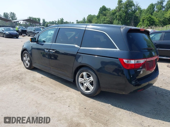 2011 Honda Odyssey Touring with VIN 5FNRL5H97BB073708, listed as a IAAI auction lot 42409164 with 141,986 mi miles and . Bid and sale history available at DreamBid. Image 3.