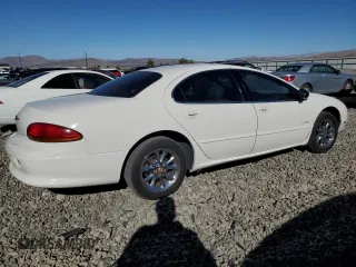 2001 Chrysler LHS z VIN 2C3AC56GX1H547856, wystawiony jako Copart lot #77842124 z przebiegiem 97 378 mil mil oraz Tytuł czysty. Historia ofert i sprzedaży dostępna na DreamBid. Obrazek 3.