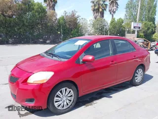2009 Toyota Yaris with VIN JTDBT903591342243, listed as a IAAI auction lot 42104557 with 407,106 mi miles. Bid and sale history available at carsss.com. Image 6.