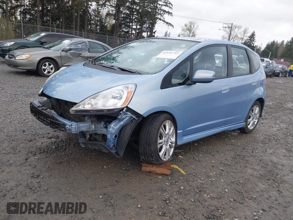 2009 Honda Fit Sport w/Navi with VIN JHMGE886X9S042490, listed as a IAAI auction lot 41931712 with 111,088 mi miles. Bid and sale history available at carsss.com. Image 2.