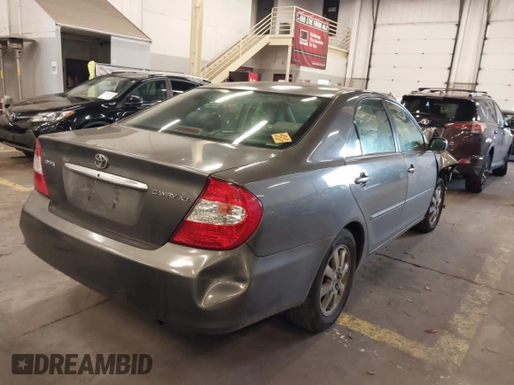 2003 Toyota Camry LE with VIN 4T1BE32K13U754348, listed as a IAAI auction lot 41765418 with 194,227 mi miles and . Bid and sale history available at DreamBid. Image 4.