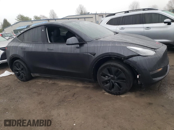 2025 Tesla Model Y Long Range z VIN 7SAYGDED9SF269767, wystawiony jako Copart lot #51588985 z przebiegiem 1 943 mil mil oraz Szkoda całkowita • Salvage title. Historia ofert i sprzedaży dostępna na DreamBid. Obrazek 4.