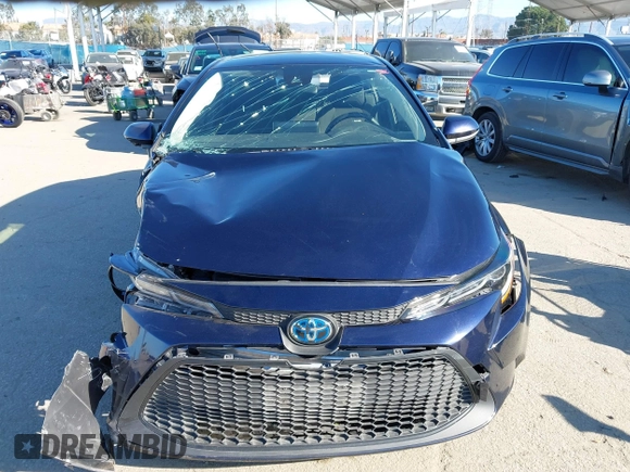 2021 Toyota Corolla Hybrid LE with VIN JTDEAMDEXMJ018828, listed as a IAAI auction lot 41633192 with 63,302 mi miles. Bid and sale history available at carsss.com. Image 13.