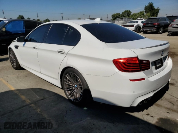 2014 BMW M5 with VIN WBSFV9C57ED097570, listed as a Copart auction lot 88571785 with 100,391 mi miles and Salvage Title. Bid and sale history available at carsss.com. Image 2.