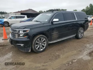 2015 Chevrolet Suburban LTZ with VIN 1GNSCKKCXFR303589, listed as a Copart auction lot 50590045 with 276,249 mi miles and Salvage Title. Bid and sale history available at DreamBid. Image 1.