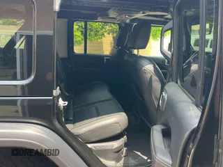 2023 Jeep Wrangler Sahara with VIN 1C4JJXP65PW627241, listed as a Copart auction lot 55661585 with 9,282 mi miles and Clean Title. Bid and sale history available at DreamBid. Image 6.