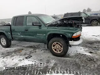 2002 Dodge Dakota SLT с VIN 1B7HG48N12S614309, выставлен на аукционе Copart как лот 87309554 с пробегом 287 994 миль миль и Списание • Salvage title. История ставок и продаж доступна на DreamBid. Изображение 10.
