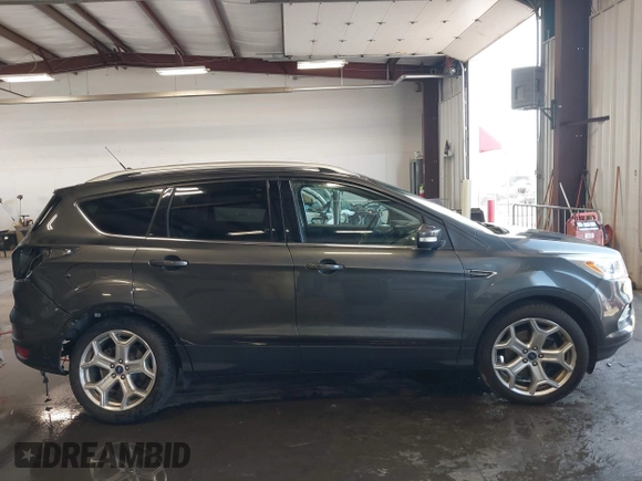 2019 Ford Escape Titanium with VIN 1FMCU9J97KUC55772, listed as a IAAI auction lot 42514001 with 77,737 mi miles and . Bid and sale history available at DreamBid. Image 14.