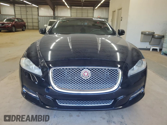 2015 Jaguar XJ with VIN SAJWJ1CD9F8V83885, listed as a Copart auction lot 65625135 with 81,794 mi miles and Clean title. Bid and sale history available at DreamBid. Image 5.