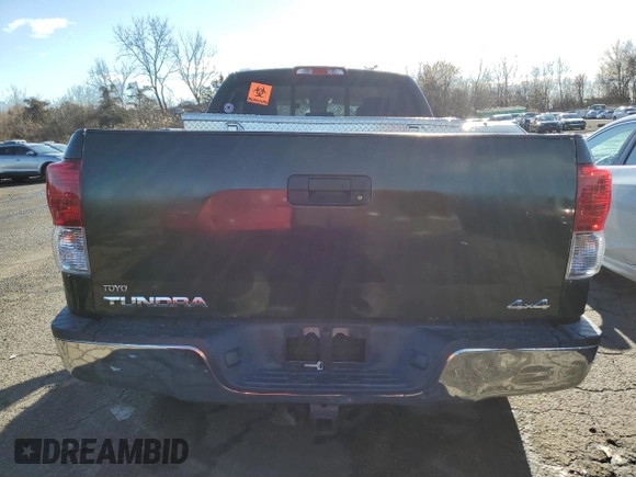 2013 Toyota Tundra z VIN 5TFUY5F12DX288608, wystawiony jako Copart lot #86147124 z przebiegiem Nie podano mil oraz Szkoda całkowita • Salvage title. Historia ofert i sprzedaży dostępna na DreamBid. Obrazek 6.