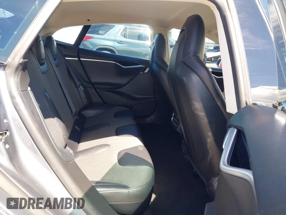 2014 Tesla Model S 60 with VIN 5YJSA1S15EFP29010, listed as a IAAI auction lot 41798180 with 142,754 mi miles and . Bid and sale history available at DreamBid. Image 8.