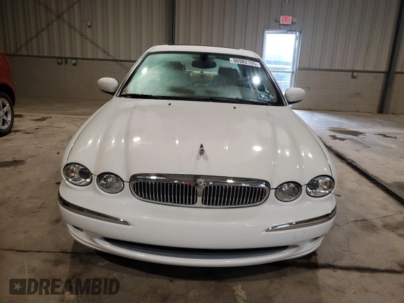 2004 Jaguar X-Type with VIN SAJEA51C34WE06046, listed as a Copart auction lot 56982105 with 69,265 mi miles and Clean Title. Bid and sale history available at DreamBid. Image 5.