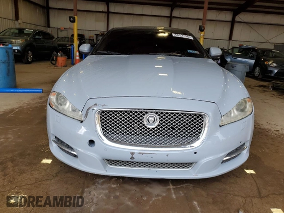 2013 Jaguar XJ with VIN SAJWJ1CD1D8V51462, listed as a Copart auction lot 50527985 with 62,995 mi miles and Salvage title. Bid and sale history available at DreamBid. Image 5.