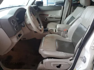 2010 Jeep Commander Limited with VIN 1J4RG5GT0AC137563, listed as a Copart auction lot 54178235 with 146,196 mi miles and Salvage title. Bid and sale history available at DreamBid. Image 7.