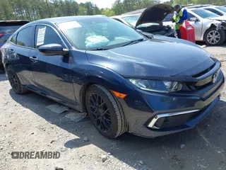2020 Honda Civic LX with VIN 19XFC2F61LE006457, listed as a IAAI auction lot 41984180 with 79,361 mi miles and . Bid and sale history available at DreamBid. Image 1.