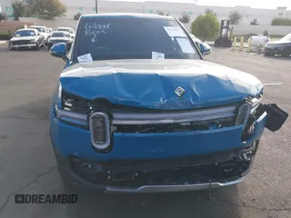 2025 Rivian R1T Adventure z VIN 7FCTGBAA9SN035986, wystawiony jako IAAI lot #41510257 z przebiegiem 2 102 mil mil oraz . Historia ofert i sprzedaży dostępna na DreamBid. Obrazek 6.