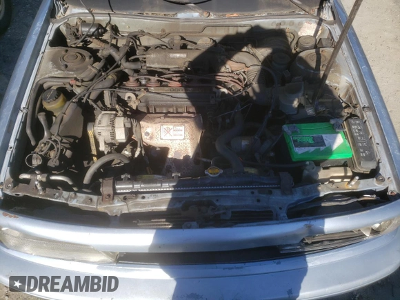 1991 Toyota Camry DLX z VIN 4T1SV21E2MU451022, wystawiony jako Copart lot #45333385 z przebiegiem 229 058 mil mil oraz Szkoda całkowita • Salvage title. Historia ofert i sprzedaży dostępna na DreamBid. Obrazek 12.