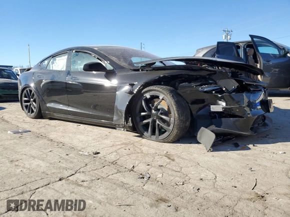 2023 Tesla Model S with VIN 5YJSA1E5XPF519570, listed as a Copart auction lot 80573863 with Not provided miles and Salvage title. Bid and sale history available at DreamBid. Image 4.