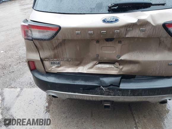 2021 Ford Escape Titanium Hybrid with VIN 1FMCU9DZXMUA66161, listed as a IAAI auction lot 41208651 with 61,198 mi miles and . Bid and sale history available at DreamBid. Image 6.