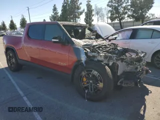 2023 Rivian R1T Adventure z VIN 7FCTGAAA0PN024599, wystawiony jako Copart lot #50269955 z przebiegiem Nie podano mil oraz Szkody całkowita. Historia ofert i sprzedaży dostępna na DreamBid. Obrazek 4.
