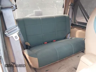 1998 Jeep Wrangler Sahara z VIN 1J4FY49SXWP716218, wystawiony jako IAAI lot #42354433 z przebiegiem 234 378 mil mil oraz . Historia ofert i sprzedaży dostępna na DreamBid. Obrazek 8.