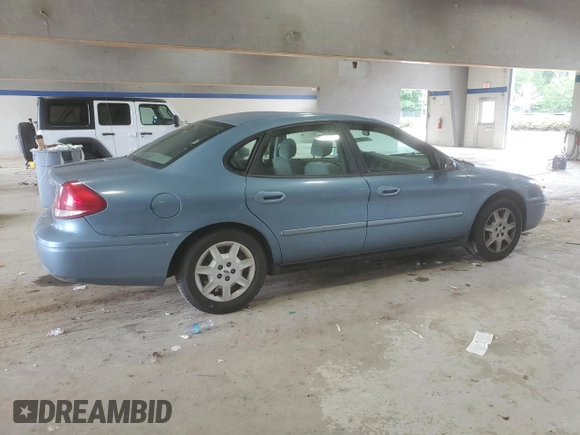 2007 Ford Taurus SE with VIN 1FAFP53U17A215432, listed as a Copart auction lot 64029215 with 121,190 mi miles and Salvage title. Bid and sale history available at DreamBid. Image 3.
