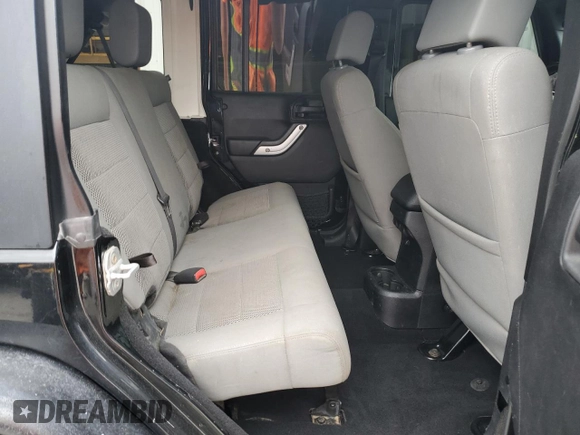 2014 Jeep Wrangler Unlimited Rubicon X with VIN 1C4HJWFG0EL142071, listed as a Copart auction lot 56187575 with 110,597 mi miles and Salvage title. Bid and sale history available at DreamBid. Image 11.