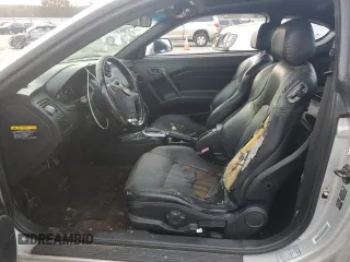 2003 Hyundai Tiburon GT z VIN KMHHN65F63U064962, wystawiony jako Copart lot #44804045 z przebiegiem 186 171 mil mil oraz Szkoda całkowita • Salvage title. Historia ofert i sprzedaży dostępna na DreamBid. Obrazek 7.
