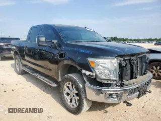 2016 Nissan Titan Platinum Reserve with VIN 1N6BA1F42GN506140, listed as a Copart auction lot 57171395 with 141,295 mi miles and Salvage title. Bid and sale history available at DreamBid. Image 4.
