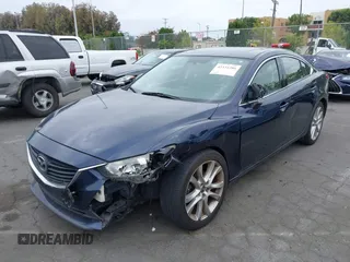 2016 Mazda 6 i Touring z VIN JM1GJ1V50G1401865, wystawiony jako IAAI lot #42334286 z przebiegiem 148 593 mil mil oraz . Historia ofert i sprzedaży dostępna na DreamBid. Obrazek 2.