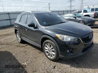 2015 Mazda CX-5 Grand Touring with VIN JM3KE4DY9F0516357, listed as a Copart auction lot 53156215 with 118,621 mi miles and Salvage Title. Bid and sale history available at DreamBid. Image 4.