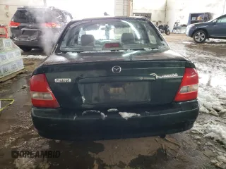 1999 Mazda Protege DX z VIN JM1BJ2220X0108600, wystawiony jako Copart lot #77004894 z przebiegiem 220 836 mil mil oraz Szkoda całkowita • Salvage title. Historia ofert i sprzedaży dostępna na DreamBid. Obrazek 6.