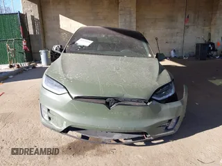 2020 Tesla Model X Long Range with VIN 5YJXCDE24LF272242, listed as a IAAI auction lot 41275226 with 103,731 mi miles. Bid and sale history available at carsss.com. Image 12.
