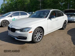2013 BMW 3 Series 335i xDrive with VIN WBA3B9C54DF587421, listed as a IAAI auction lot 42165857 with 142,331 mi miles. Bid and sale history available at carsss.com. Image 2.