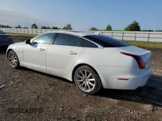 2014 Jaguar XJ Portfolio with VIN SAJWA2GZ3E8V60788, listed as a Copart auction lot 43272405 with 97,196 mi miles and Salvage title. Bid and sale history available at DreamBid. Image 2.