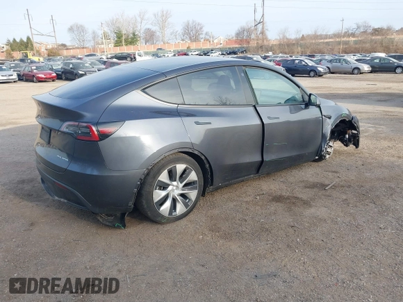 2023 Tesla Model Y Long Range with VIN 7SAYGAEEXPF612231, listed as a IAAI auction lot 41758243 with 32,924 mi miles and . Bid and sale history available at DreamBid. Image 4.