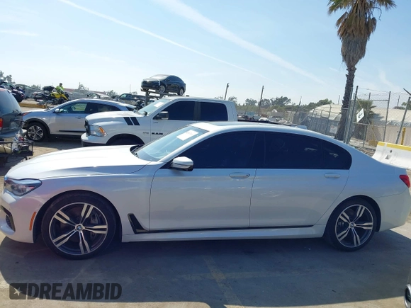 2019 BMW 7 Series 750i with VIN WBA7F0C5XKGM25771, listed as a IAAI auction lot 42167614 with 73,692 mi miles. Bid and sale history available at carsss.com. Image 14.
