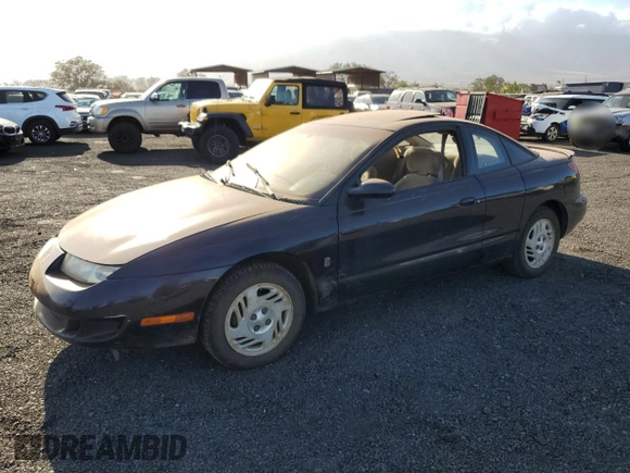 1999 Saturn SC z VIN 1G8ZR1274XZ262181, wystawiony jako Copart lot #75931774 z przebiegiem Nie podano mil oraz Szkoda całkowita • Salvage title. Historia ofert i sprzedaży dostępna na DreamBid. Obrazek 1.
