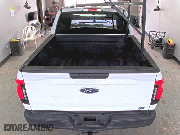 2022 Ford F-150 Lightning Pro with VIN 1FTVW1EL5NWG11725, listed as a IAAI auction lot 42832825 with 5,044 mi miles and . Bid and sale history available at DreamBid. Image 12.