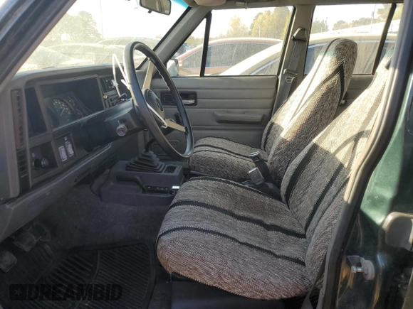 1993 Jeep Cherokee SE with VIN 1J4FJ28S0PL594889, listed as a Copart auction lot 50103425 with 174,333 mi miles and Salvage Title. Bid and sale history available at carsss.com. Image 7.