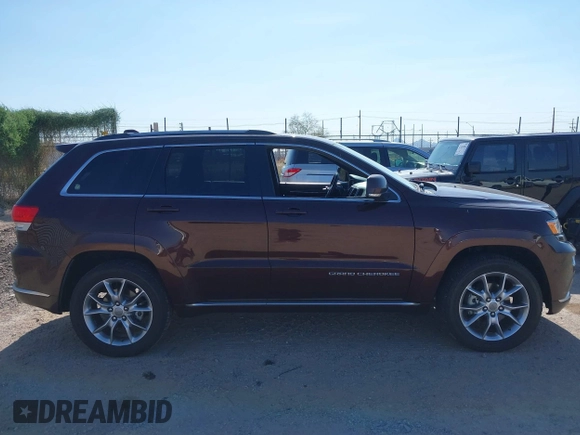 2015 Jeep Grand Cherokee Summit with VIN 1C4RJFJGXFC125131, listed as a IAAI auction lot 42475017 with 128,166 mi miles and . Bid and sale history available at DreamBid. Image 13.
