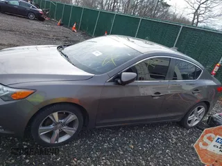 2013 Acura ILX Premium z VIN 19VDE1F54DE001539, wystawiony jako IAAI lot #42015973 z przebiegiem Nie podano mil oraz . Historia ofert i sprzedaży dostępna na DreamBid. Obrazek 13.