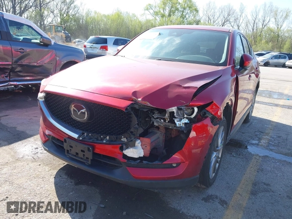 2021 Mazda CX-5 Grand Touring with VIN JM3KFBDM8M1390188, listed as a IAAI auction lot 42000444 with 84,908 mi miles. Bid and sale history available at carsss.com. Image 6.