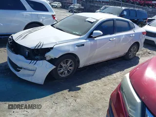 2016 Kia Optima LX with VIN KNAGT4L39G5073865, listed as a IAAI auction lot 41675211 with 120,751 mi miles. Bid and sale history available at carsss.com. Image 2.